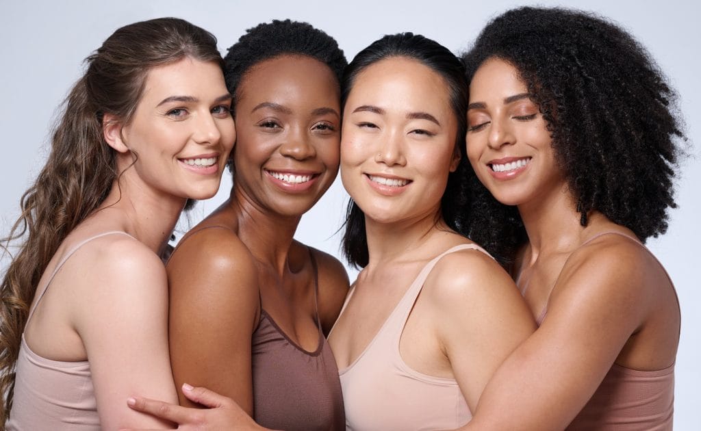 Face portrait, beauty and group of women in studio on gray background. Cosmetics, makeup and diversity of female models with glowing and flawless skin after spa facial treatment posing for skincare | Citidrips in Wilmington, DE