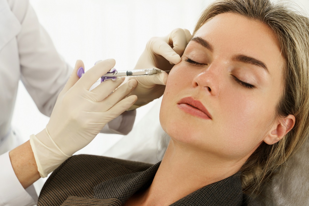 Female client during facial filler injections in aesthetic medical clinic | Citidrips in Wilmington, DE